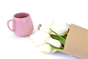 coffee cup and white flowers